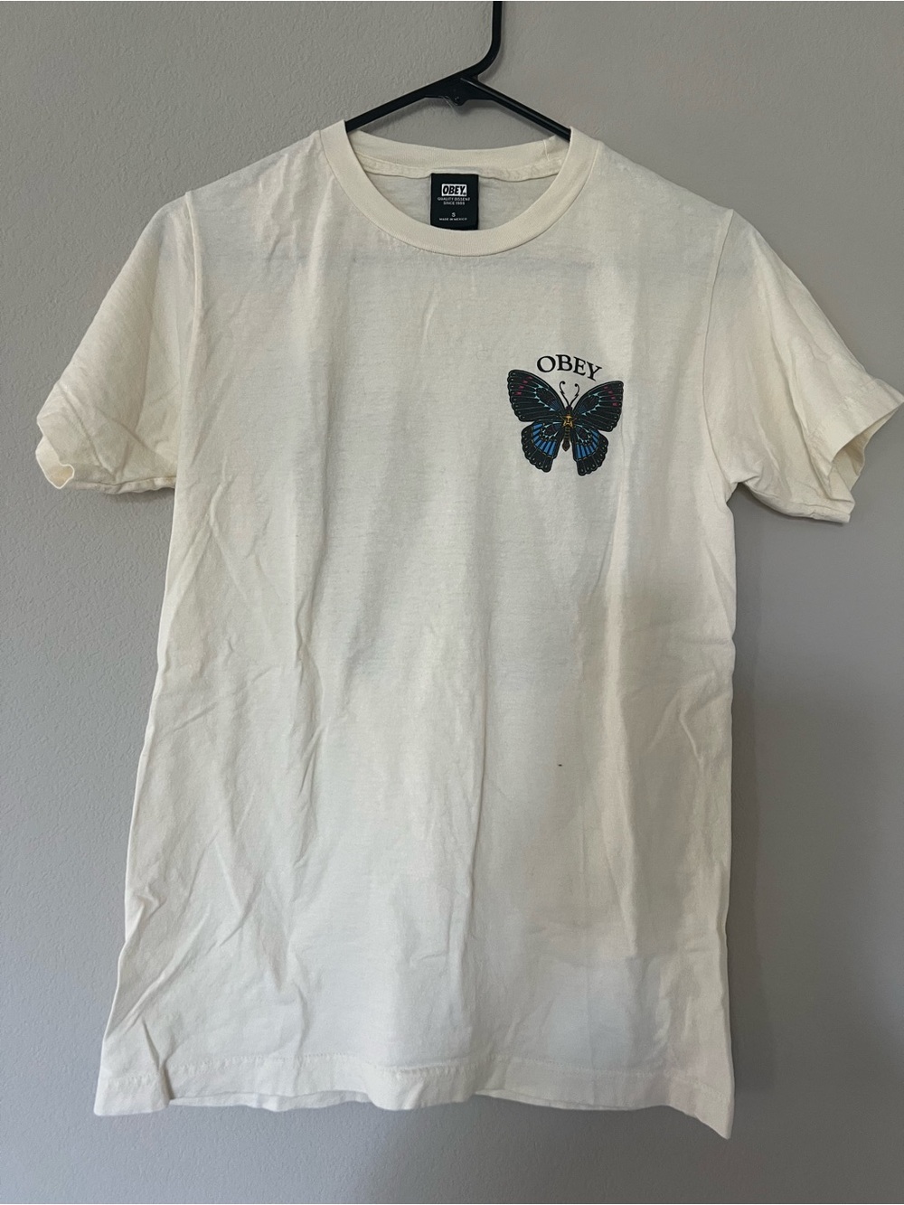 Obey Cream Tee with Blue and Black Butterfly